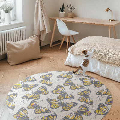 Okrúhly vinylový koberec Žlté motýle na textúre