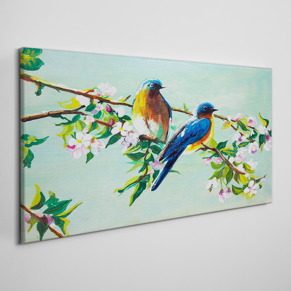 Obraz canvas Vtáky na kvitnúcej vetve