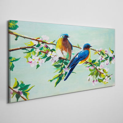 Obraz canvas Vtáky na kvitnúcej vetve