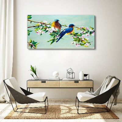 Obraz canvas Vtáky na kvitnúcej vetve
