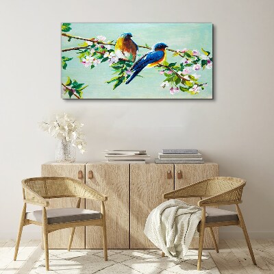 Obraz canvas Vtáky na kvitnúcej vetve