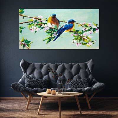 Obraz canvas Vtáky na kvitnúcej vetve