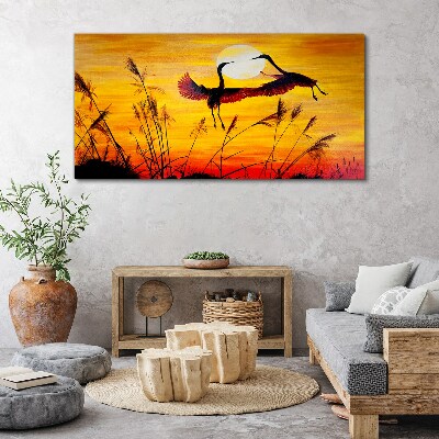 Obraz canvas Tancujúce žeriavy pri západe slnka