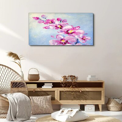 Obraz canvas Ružové orchidey na modrom pozadí