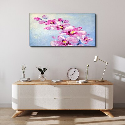 Obraz canvas Ružové orchidey na modrom pozadí