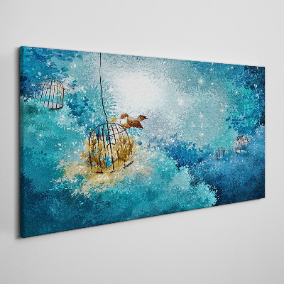 Obraz canvas Vták v klietke proti oblohe