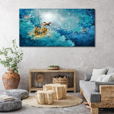 Obraz canvas Vták v klietke proti oblohe