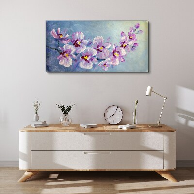 Obraz Canvas Kvetinové orchidey na modrom pozadí