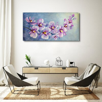 Obraz Canvas Kvetinové orchidey na modrom pozadí