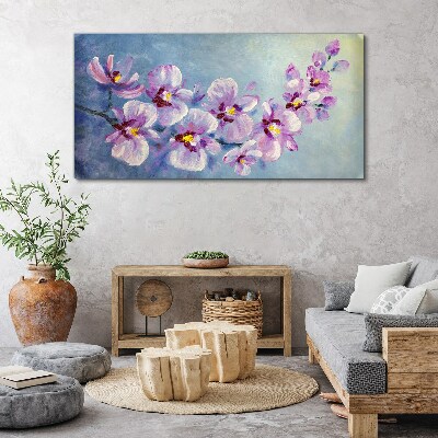 Obraz Canvas Kvetinové orchidey na modrom pozadí