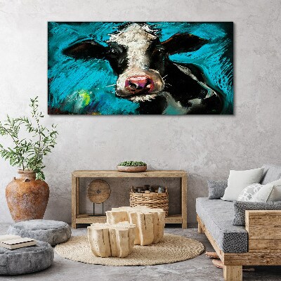 Obraz canvas Portrét kravy na modrom pozadí