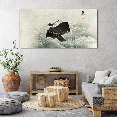 Obraz Canvas Vták na skale vo vlnách