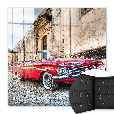 Retro auto na pozadí architektúry
