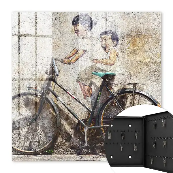 Deti a bicykel na starom múre